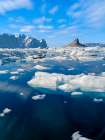 Landscape with icebergs near Ikerasak in the Uummannaq Fjord System, Greenland, Danish Territory. Art Print